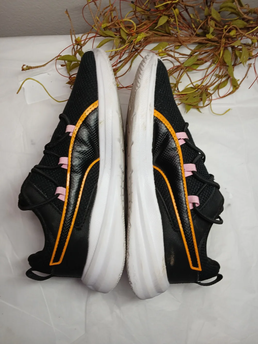 Puma Black Sneakers with Pink Accents and Orange Trim